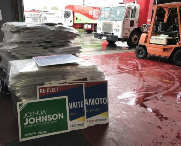 Large pile of plastic signs for recycling from BC Election