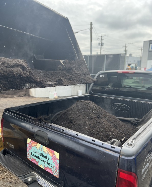 Compost soil amender being loaded loose into the bed of a pickup truck at WCS Depot, North Vancouver